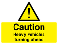 Caution heavy vehicles turning ahead