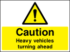 Caution heavy vehicles turning ahead